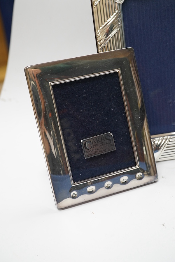 A modern boxed Carr's of Sheffield, silver mounted double photograph frame, width 18.3cm, together with two other silver mounted photograph frames and an Italian silver plated frame. Condition - good